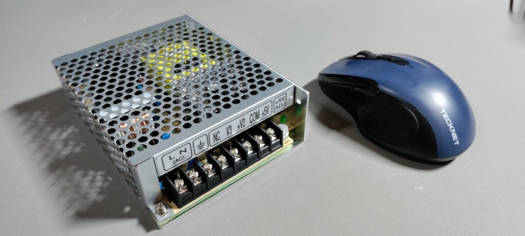 Mean Well RT-65B PSU. Mouse for scale as I'd run out of bananas.